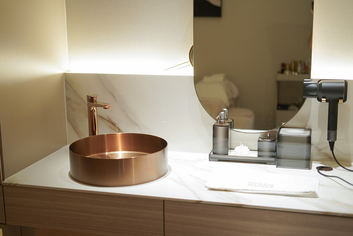 A bronze coloured wash basin